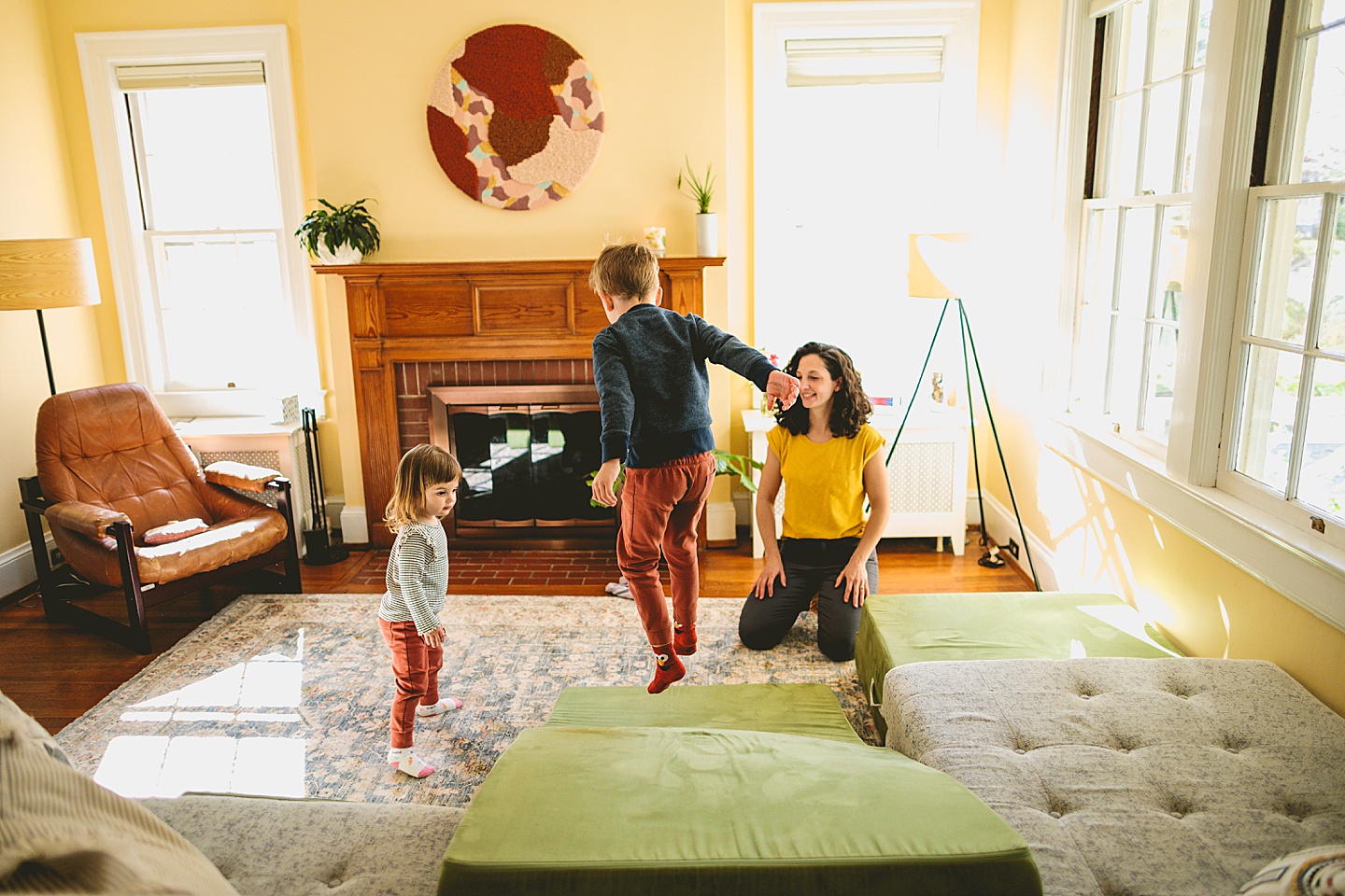 Kids having dance party in the living room during family pictures