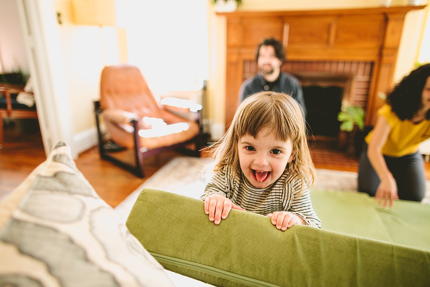 Kids having dance party in the living room during family pictures in Durham NC