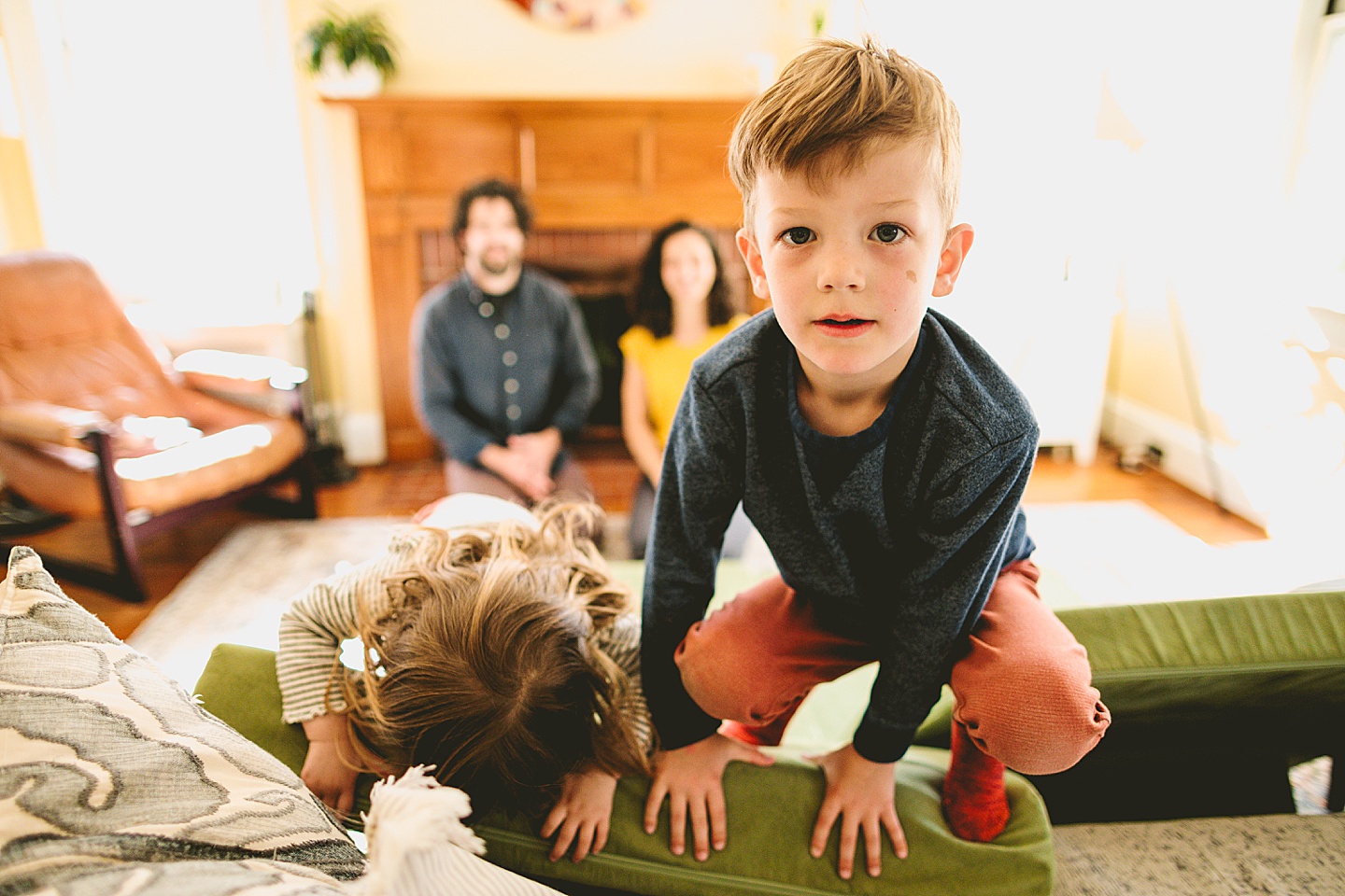 Kids having dance party in the living room during family pictures in Durham NC