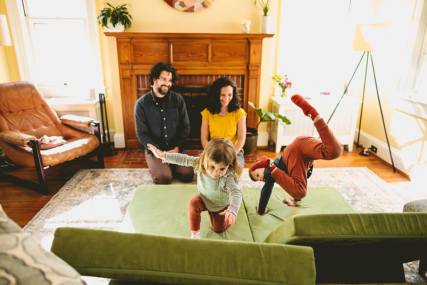 Kids having dance party in the living room during family pictures in Durham NC