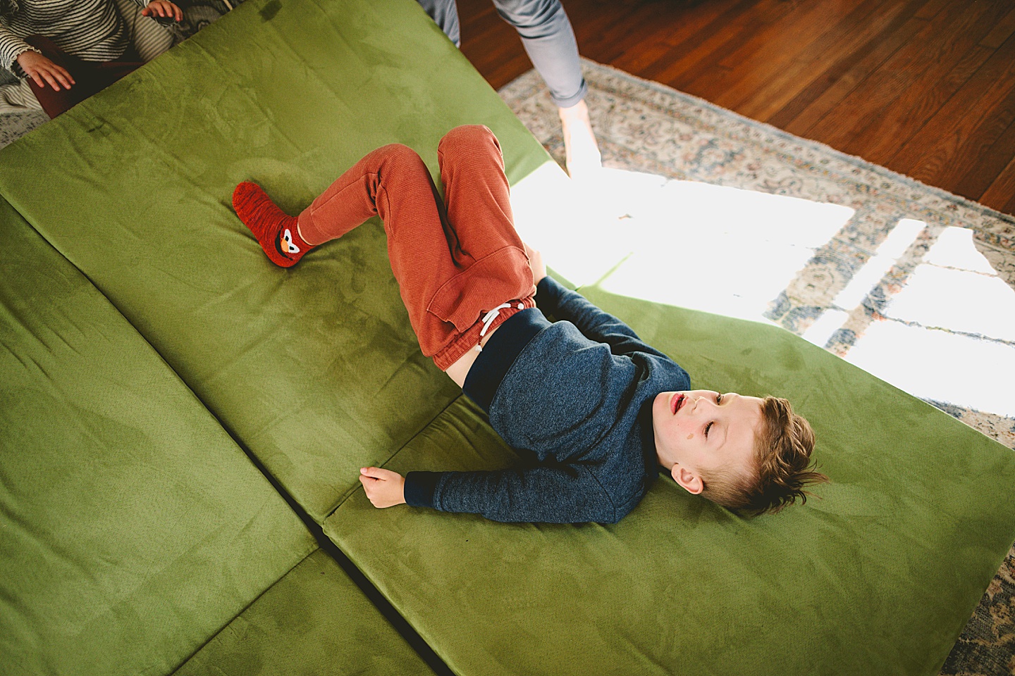 Kid laying on the couch