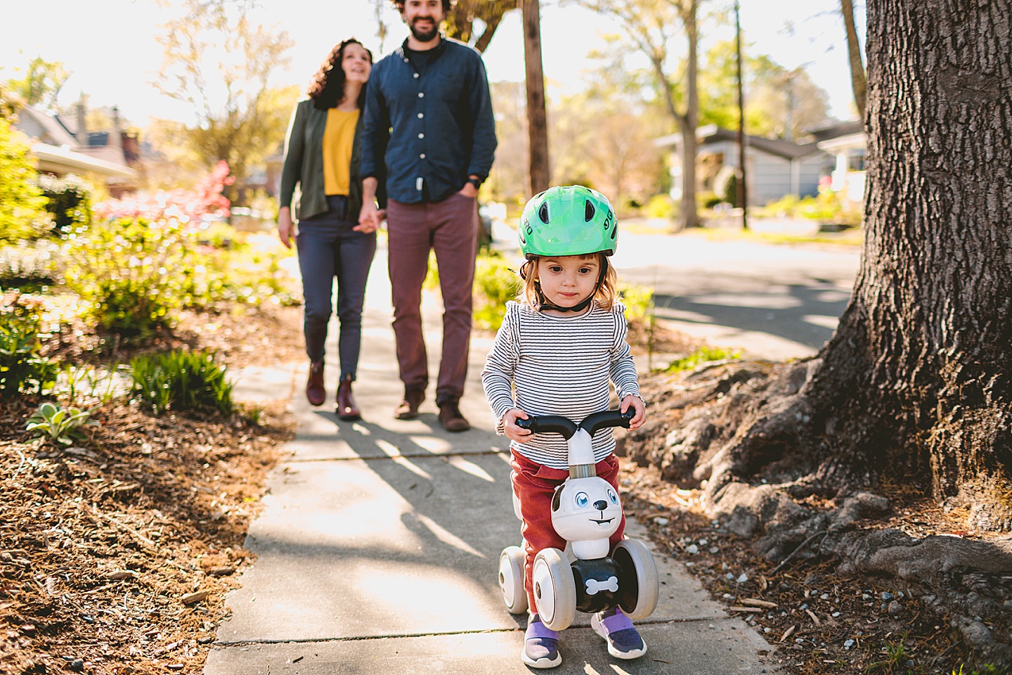 Girl riding her bike down the street