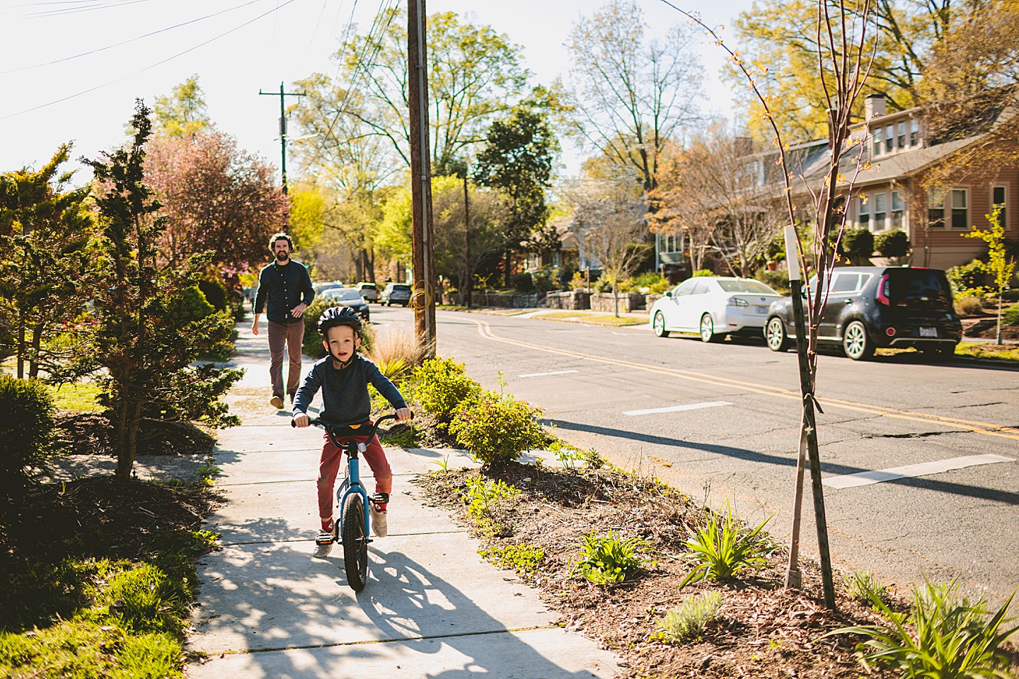 Boy riding bike in neighborhood