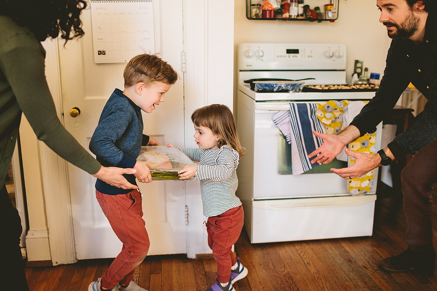 Kids handing dinner to dad