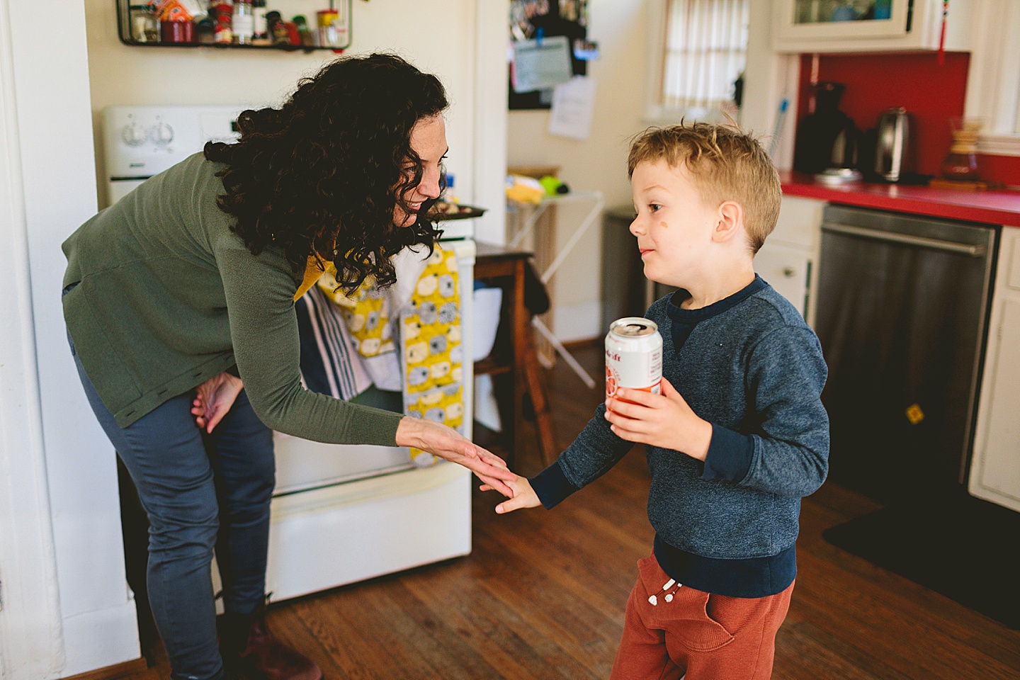 Mom giving son a high-five