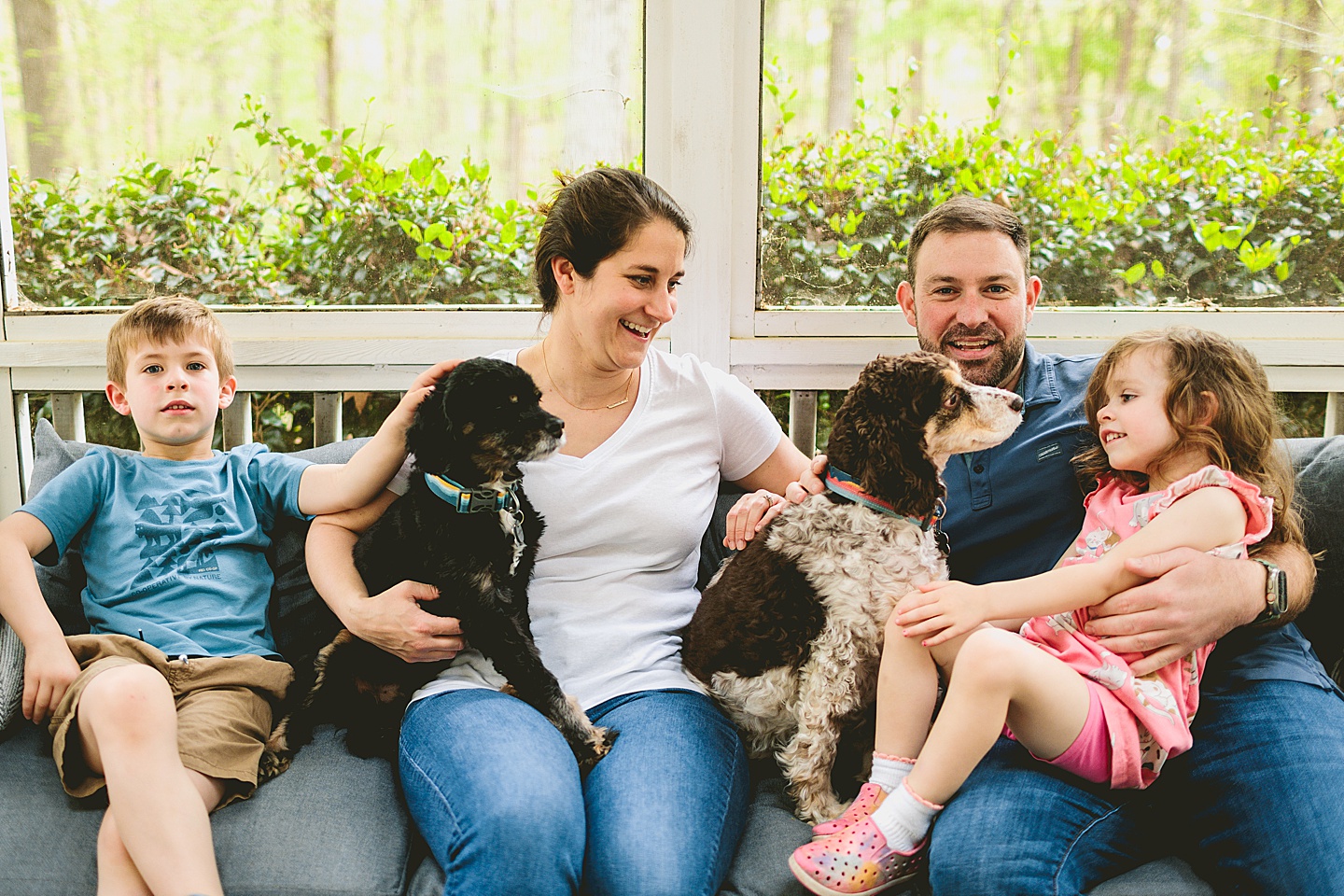 Family photos on screened in porch in Raleigh