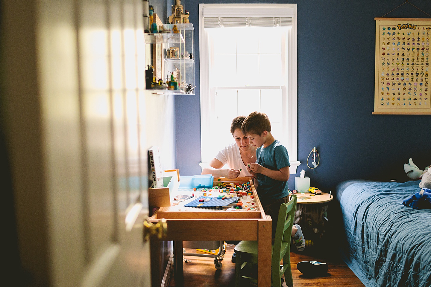 Mom building Legos with son during family photos at home in Raleigh