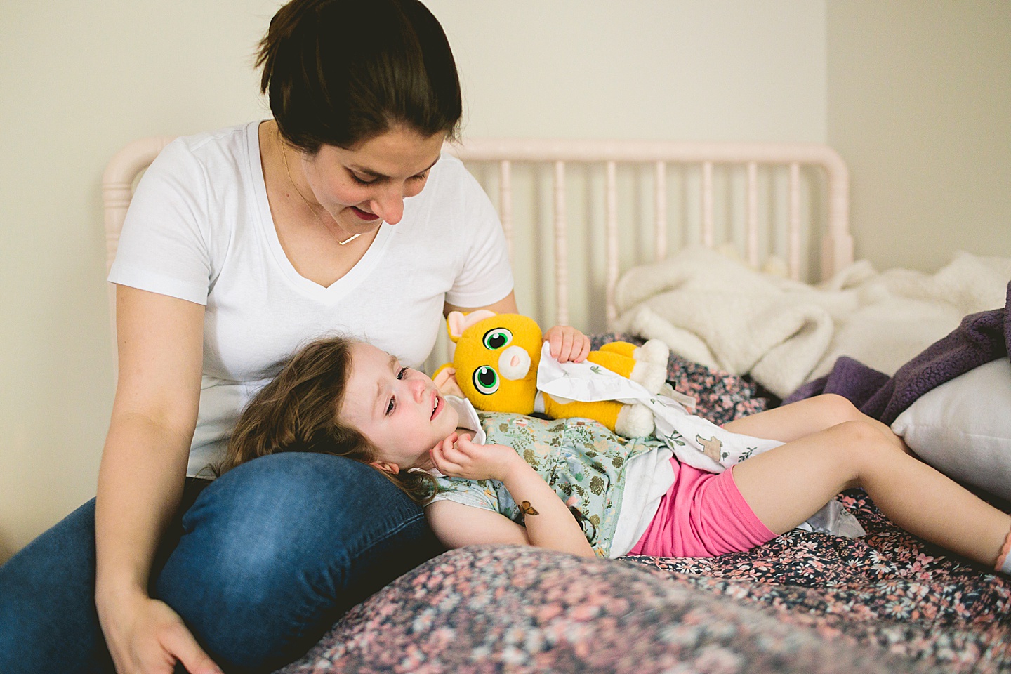 Mom comforting young girl