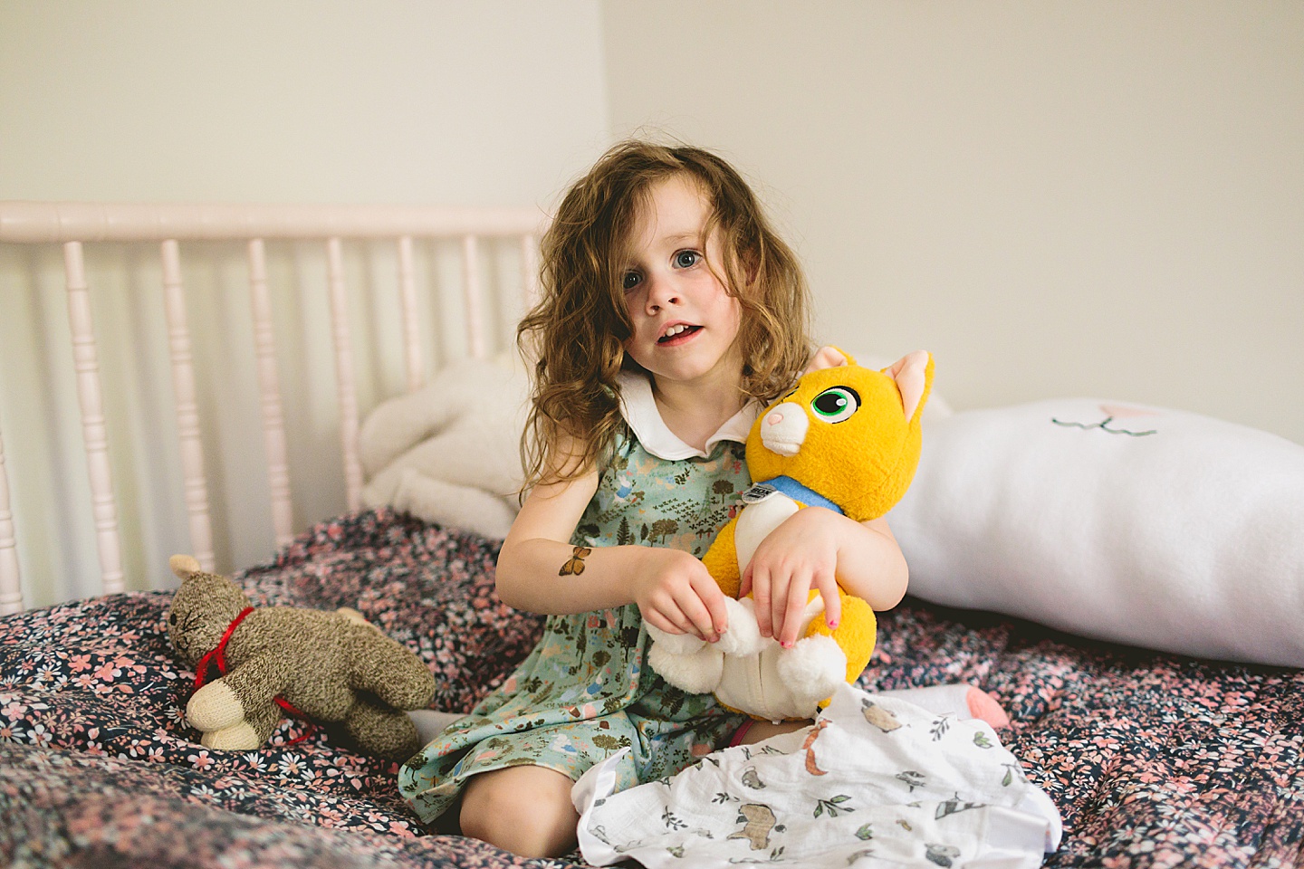 Girl holding a stuffed orange cat