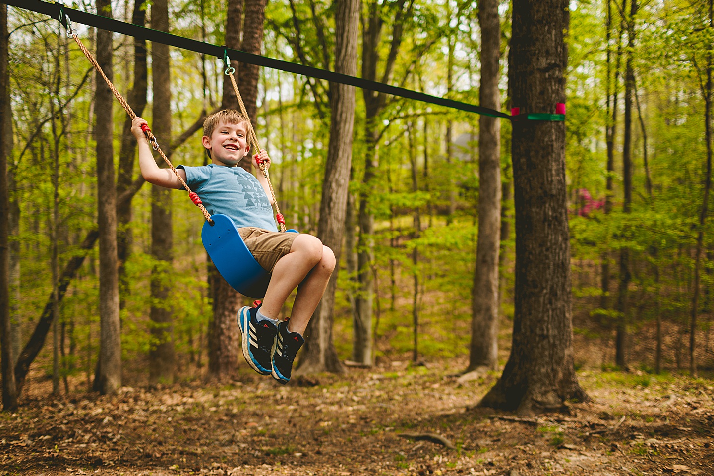 Boy on swing in backyard