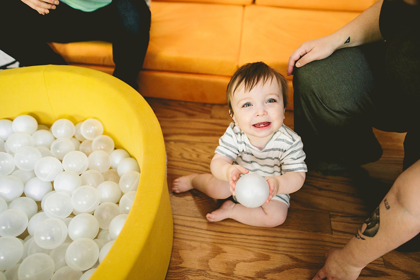 Baby playing in ball pit