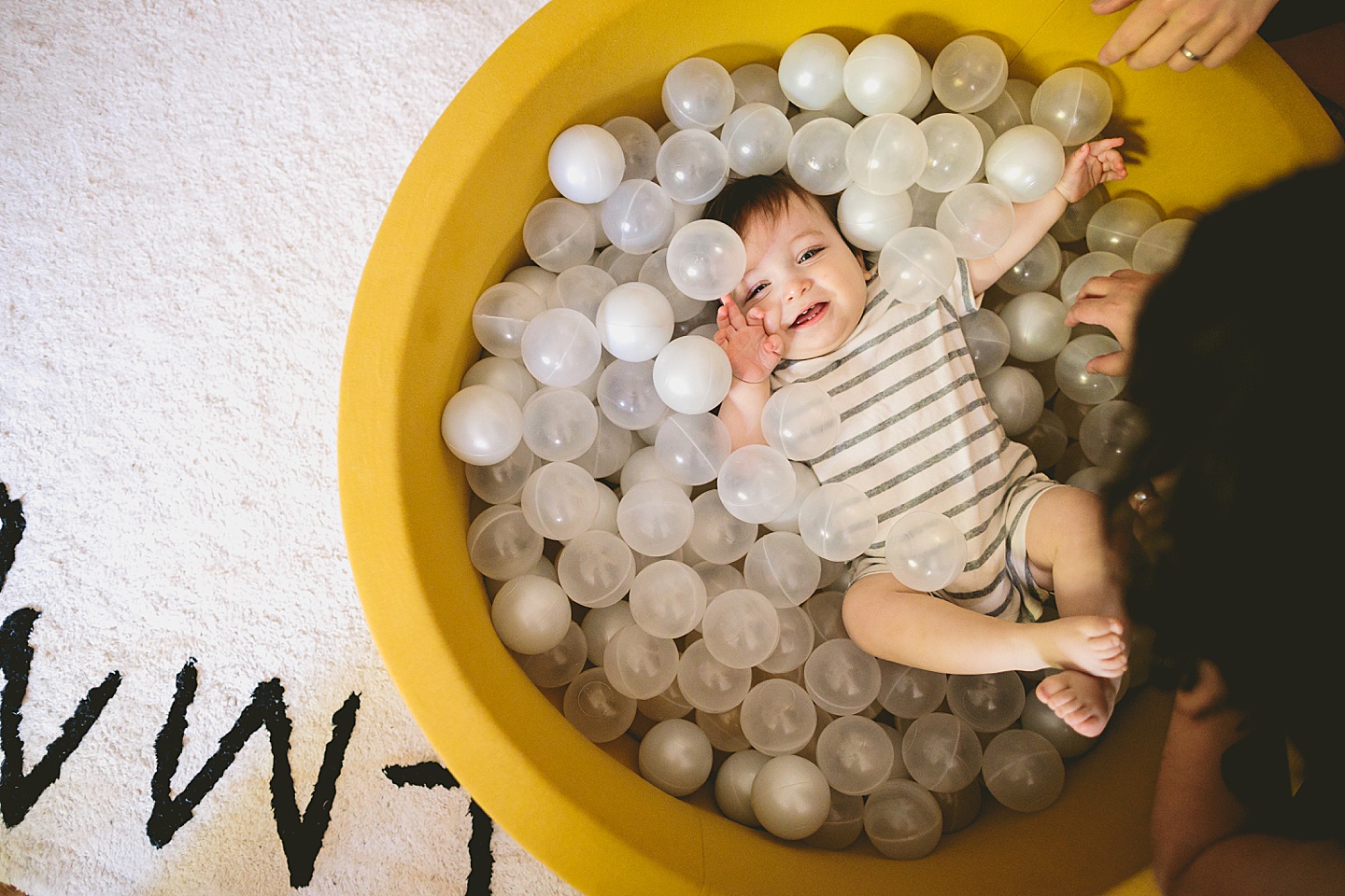 Baby playing in ball pit