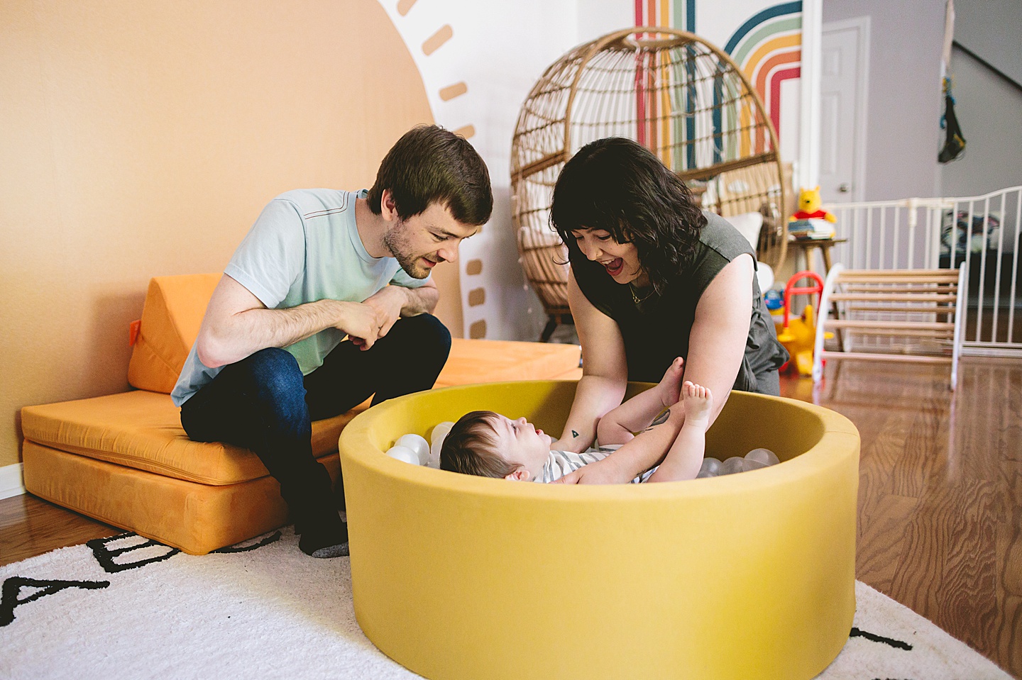 Baby playing in ball pit