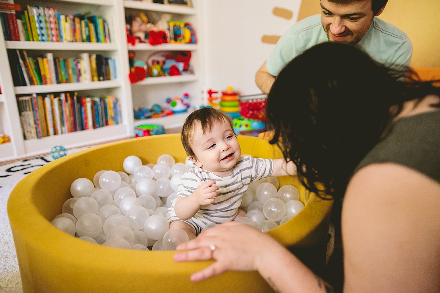Baby playing in ball pit