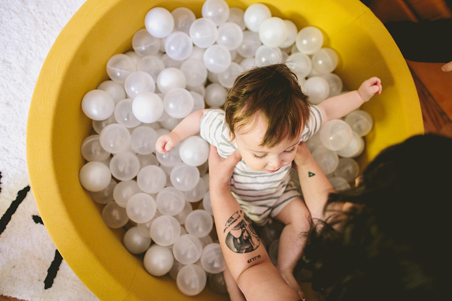 Baby playing in ball pit