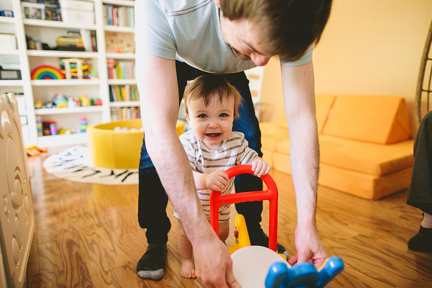 Baby walking using the help of a toy