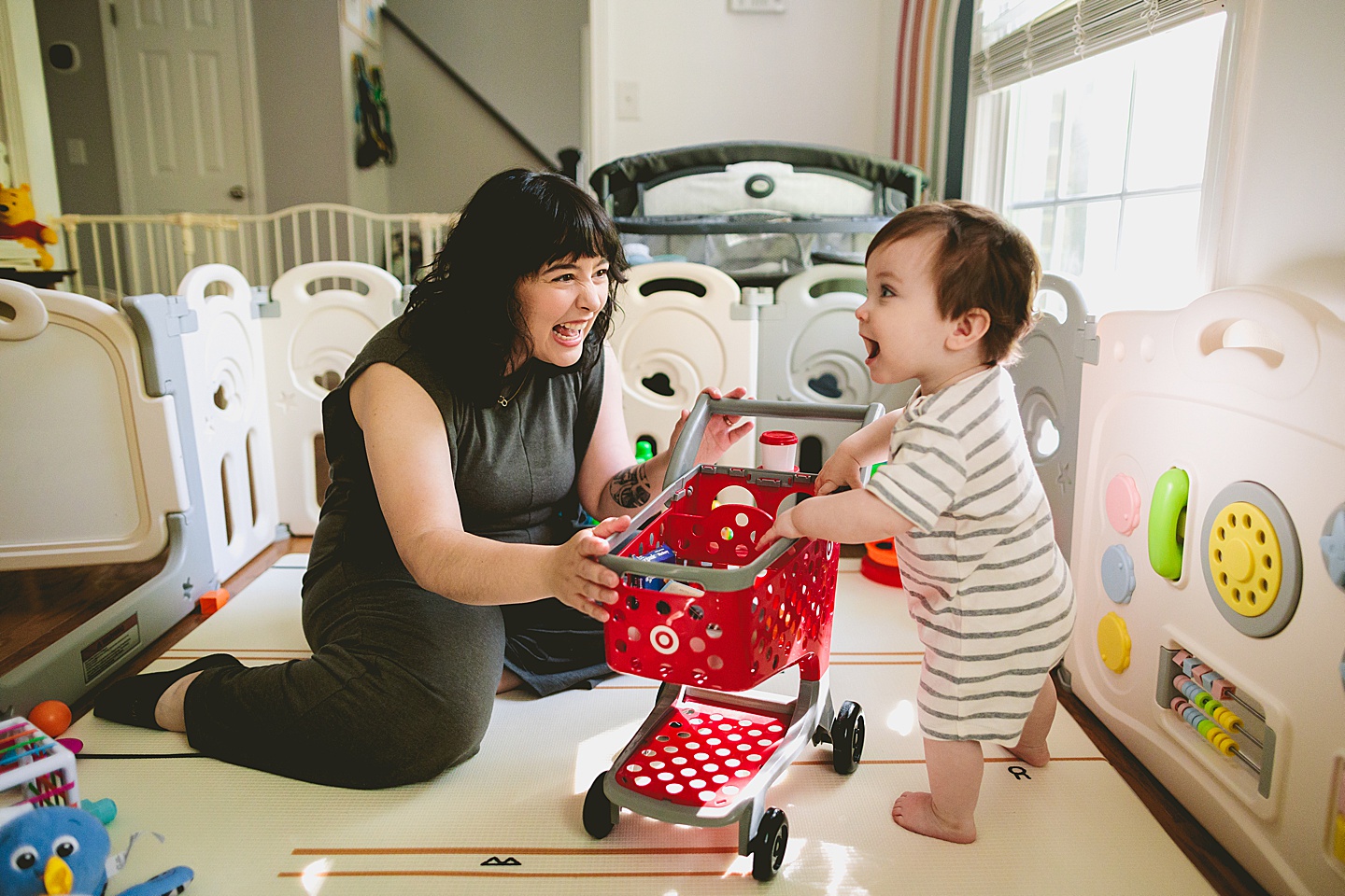 Mom laughing at baby