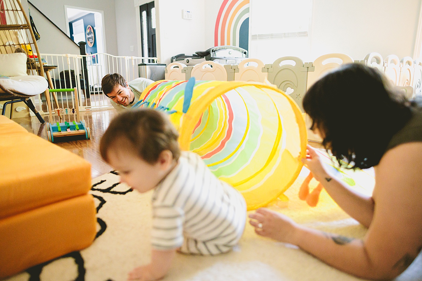 Baby crawls into rainbow tunnel