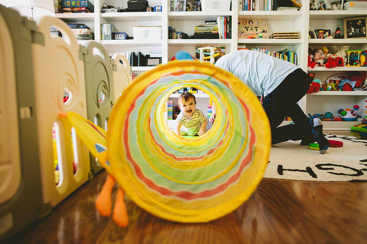 Baby crawls into rainbow tunnel