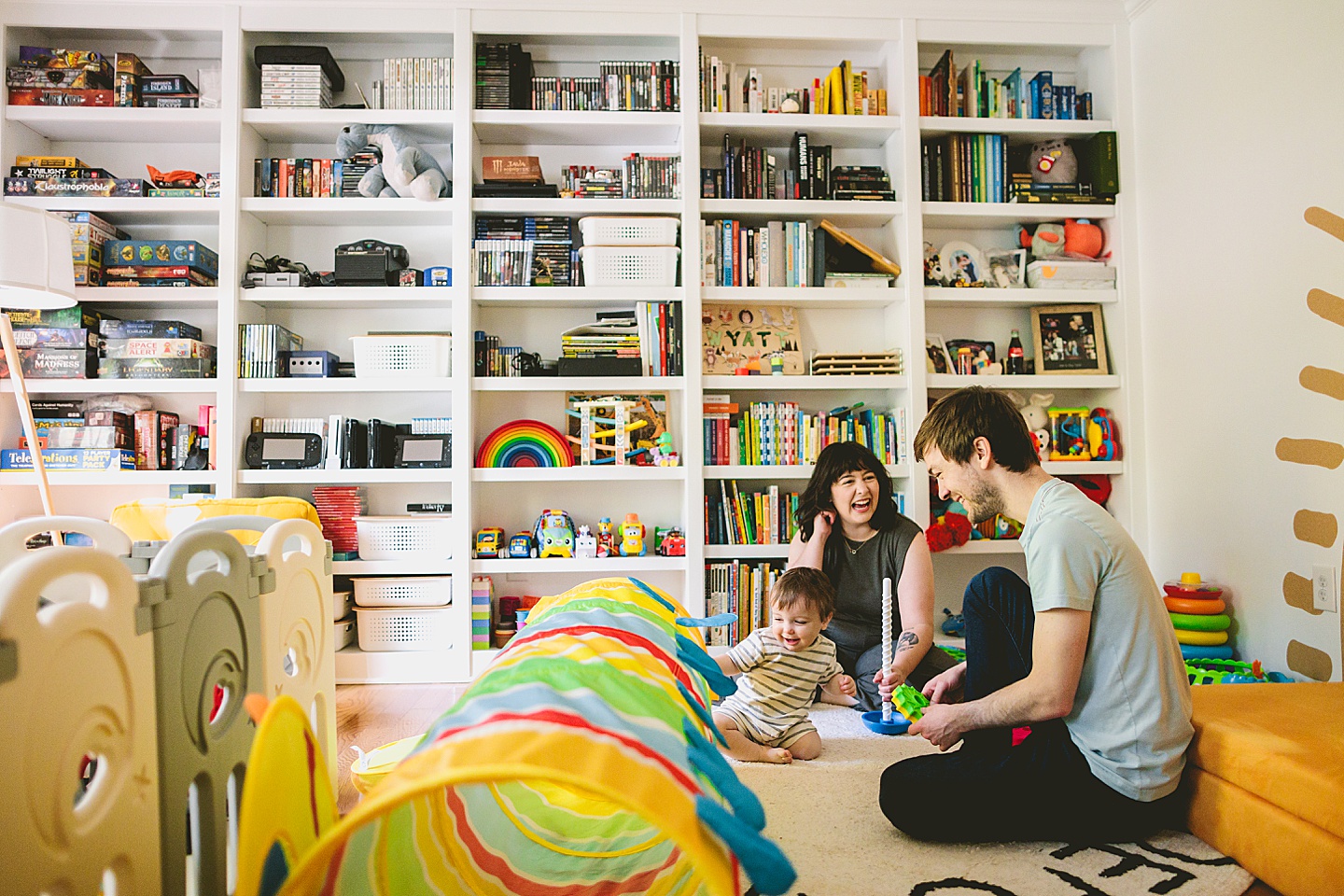 Family sitting and laughing in living room