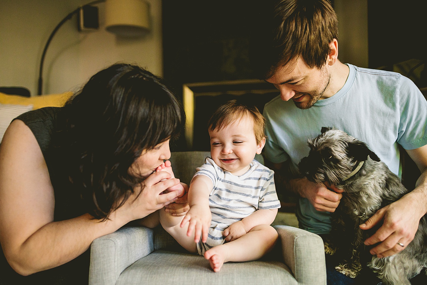 Laughing baby with dogs