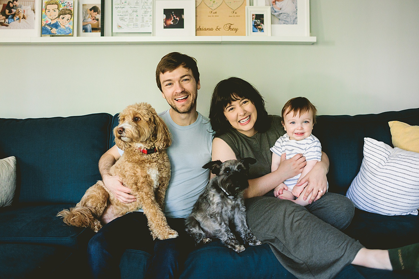 Family portrait with baby and dogs