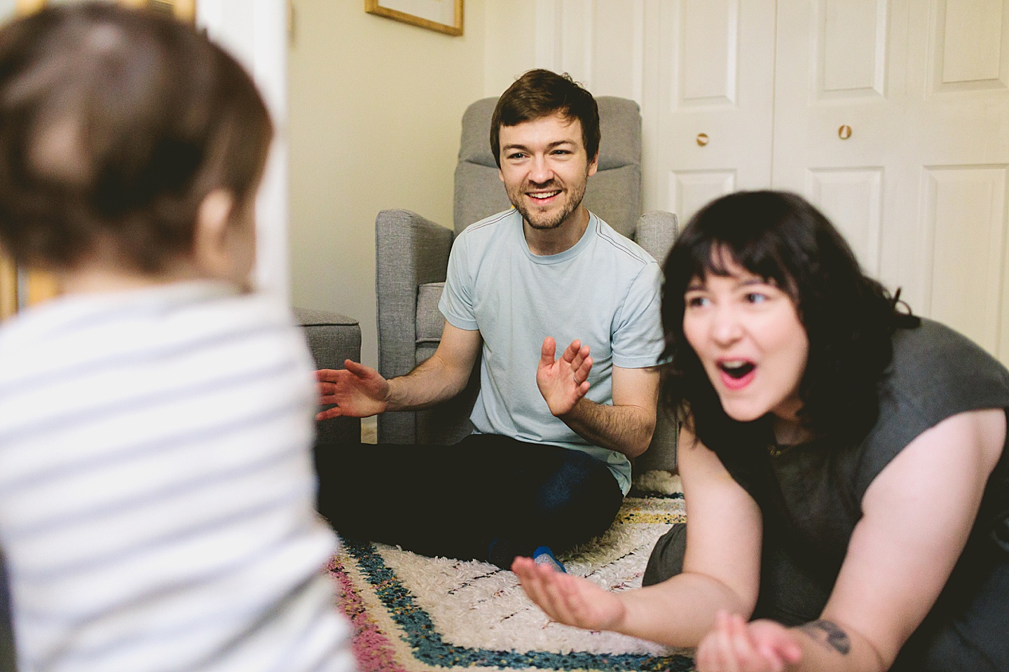 Parents interacting with young baby