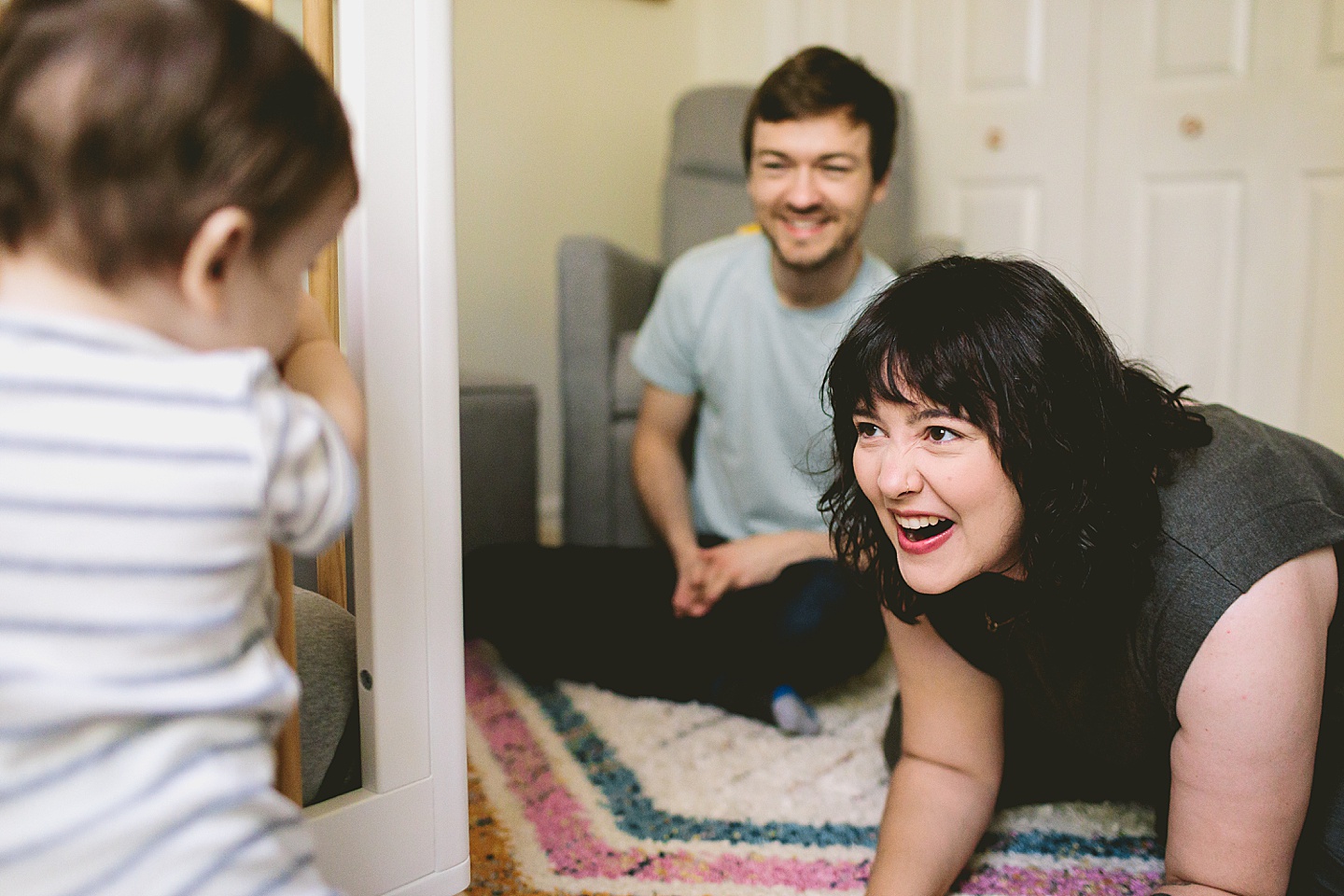 Parents interacting with young baby