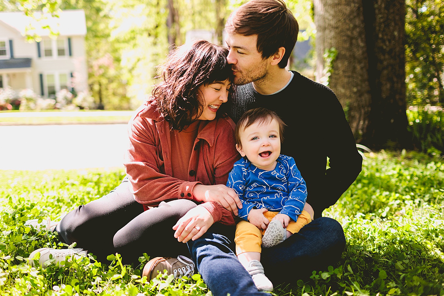 Parents holding laughing baby