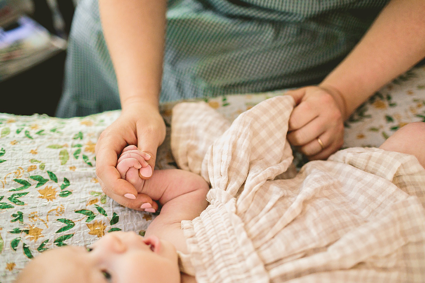 Mom holding baby's hand