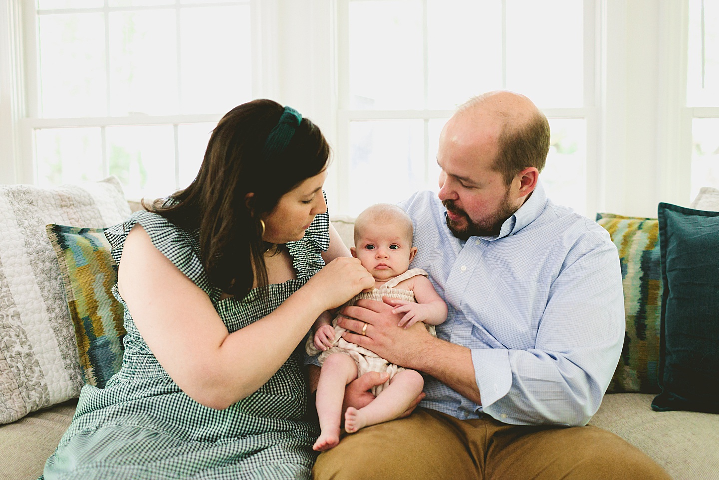 Parents holding baby during newborn photos in Chapel Hill