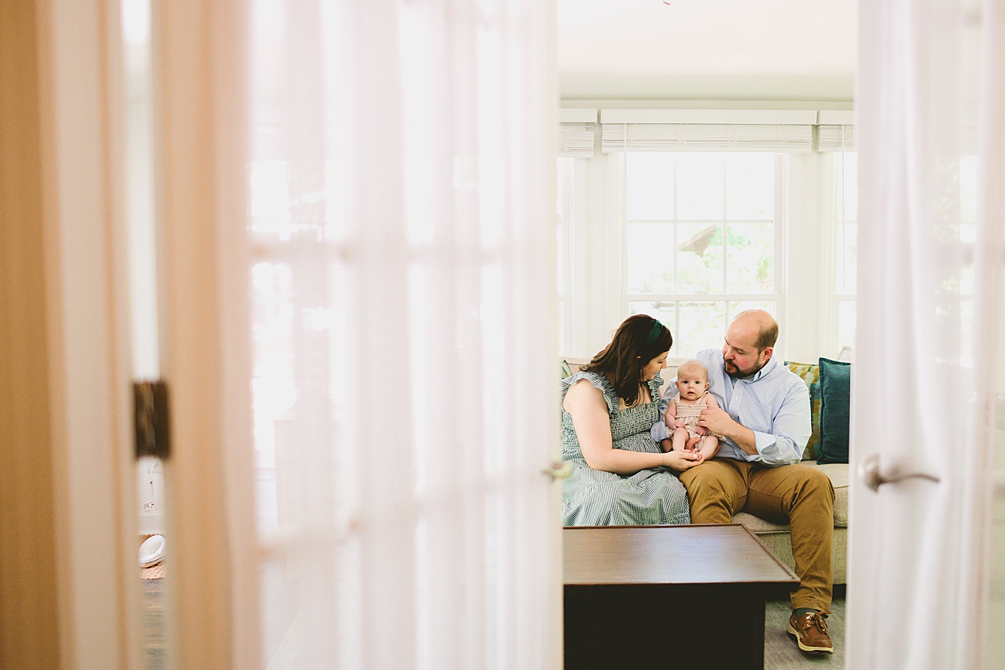 Parents holding baby during newborn photos in Chapel Hill