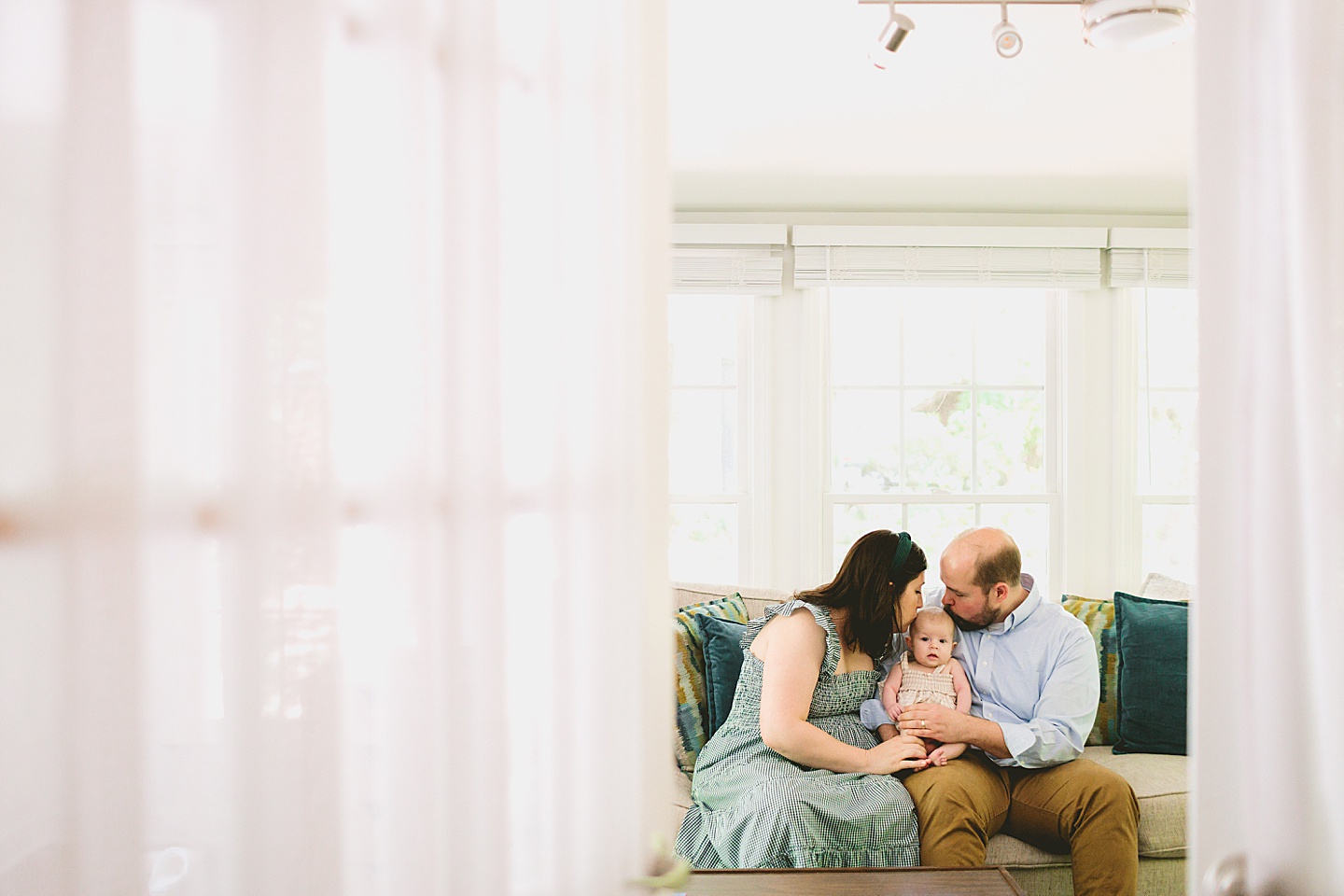 Parents holding baby during newborn photos in Chapel Hill