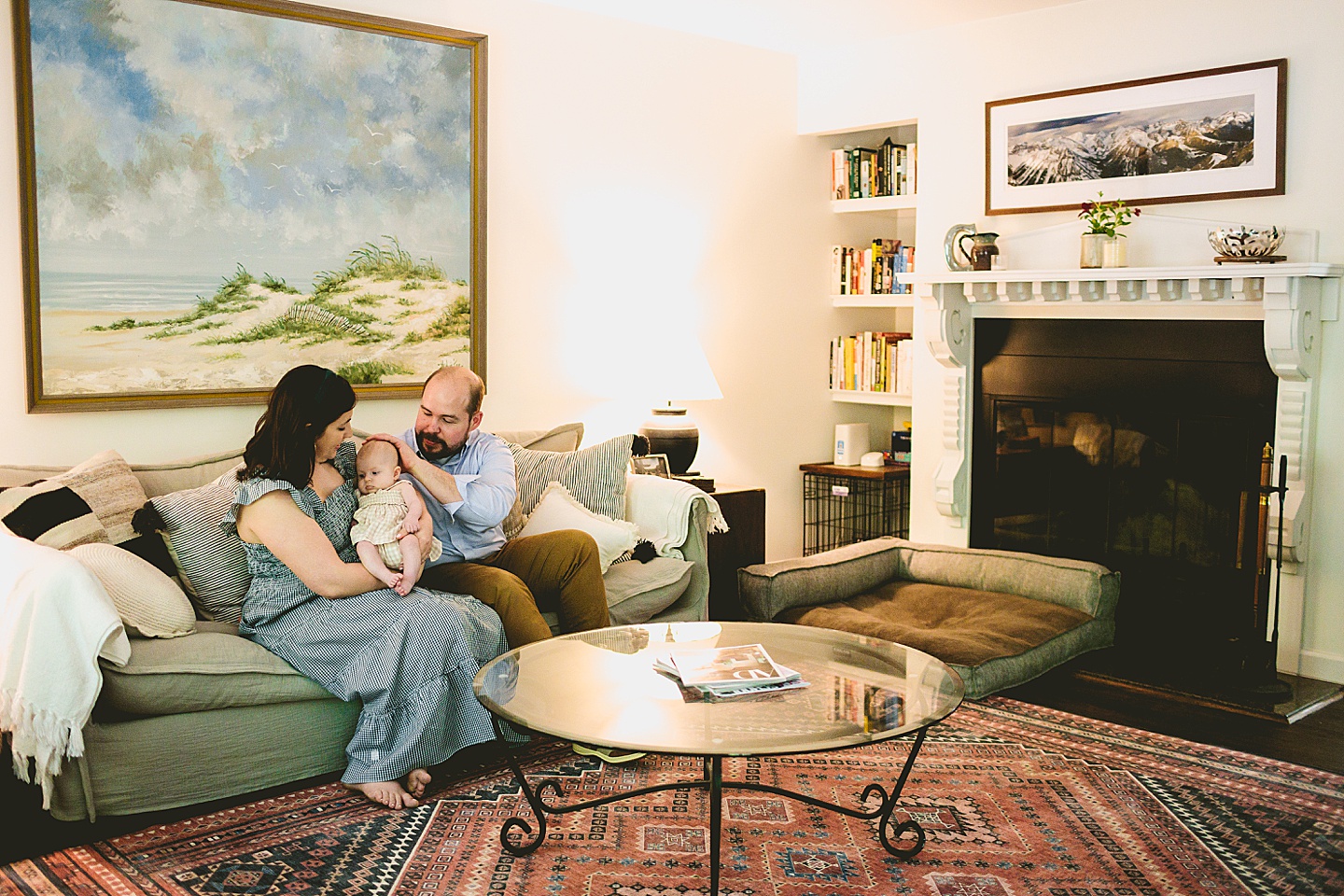 Parents sitting in living room with baby