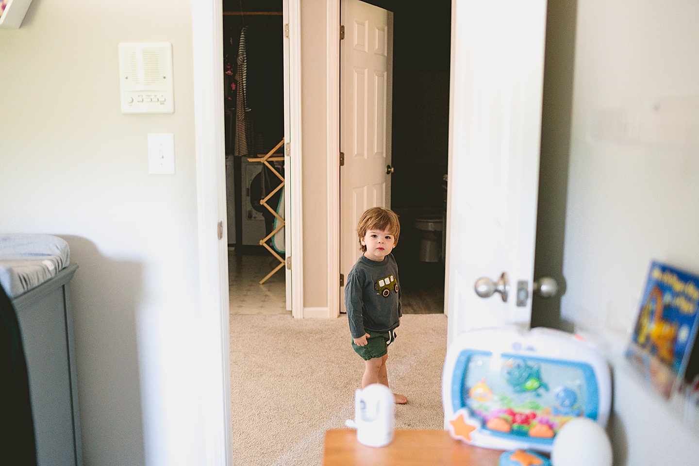 Toddler standing in hallway