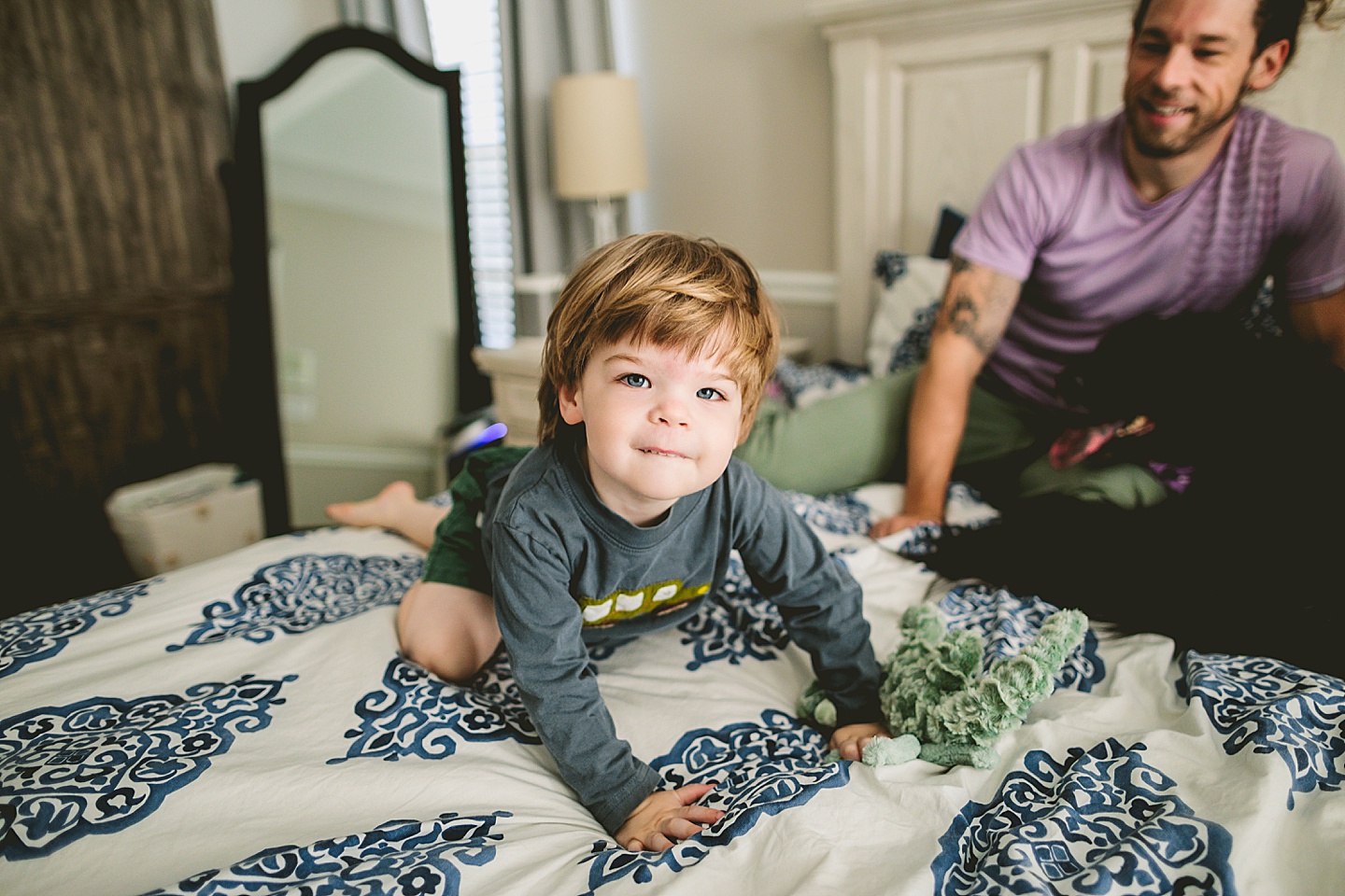 Toddler climbing off the bed