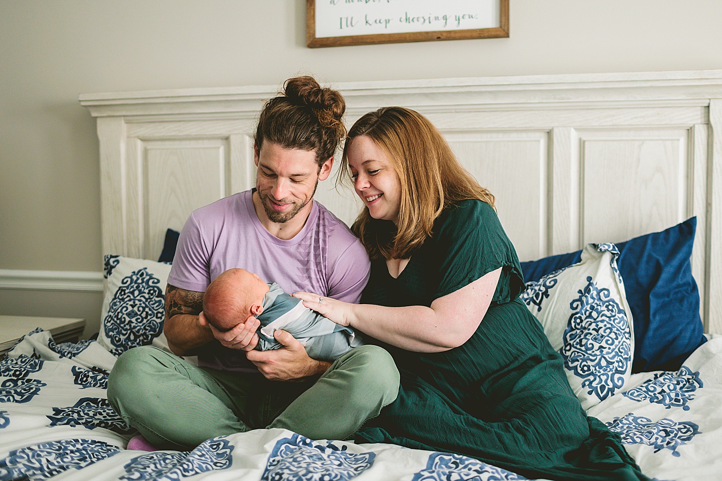 Mom and Dad holding newborn baby in Raleigh NC