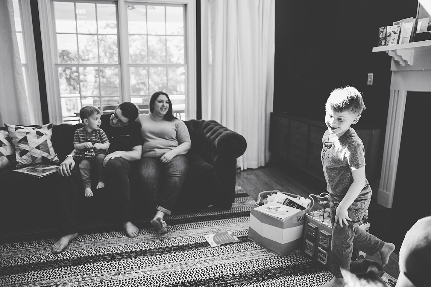 Black and white photo of family in living room