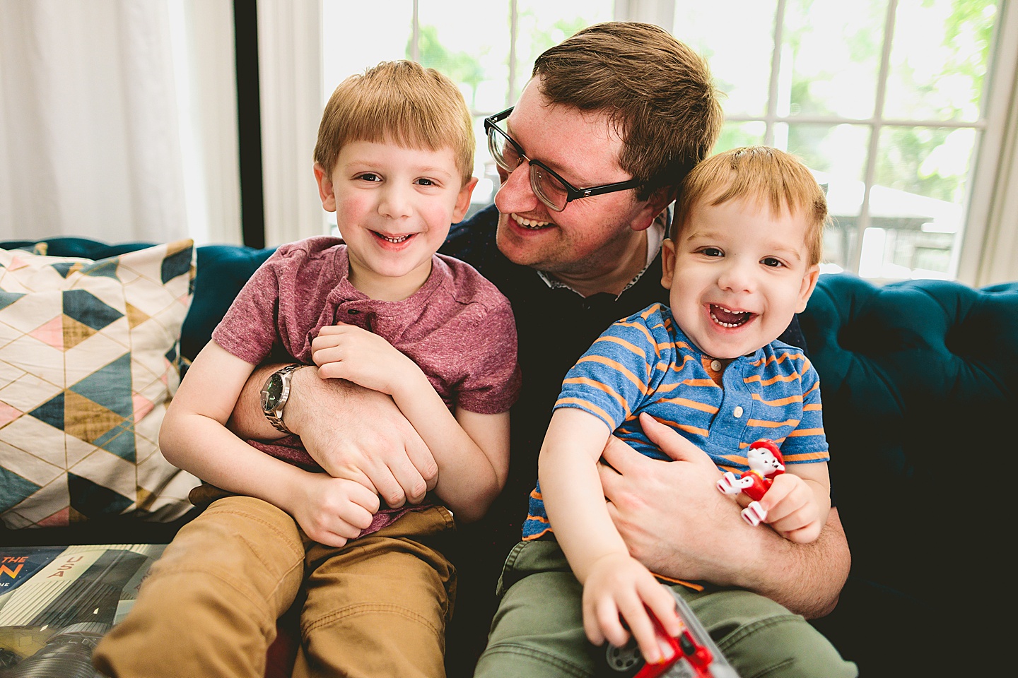 Dad smiling at sons