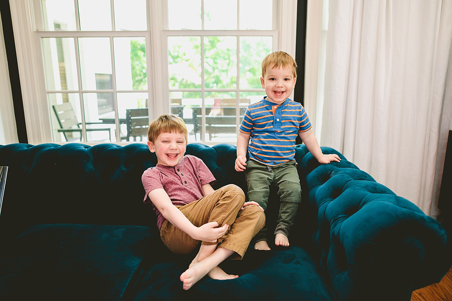 Brothers playing on the couch