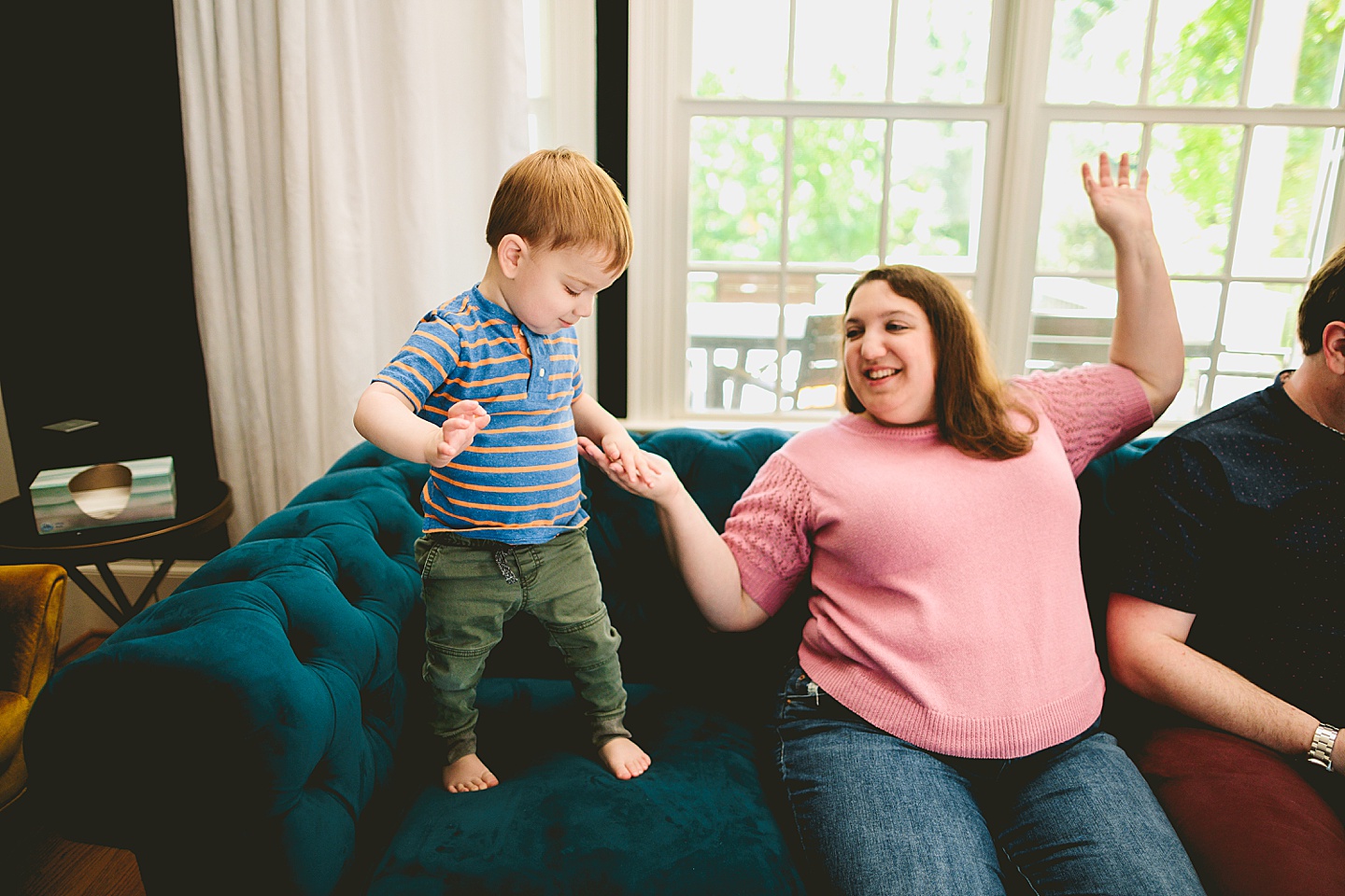 Son dancing with his mom on the couch
