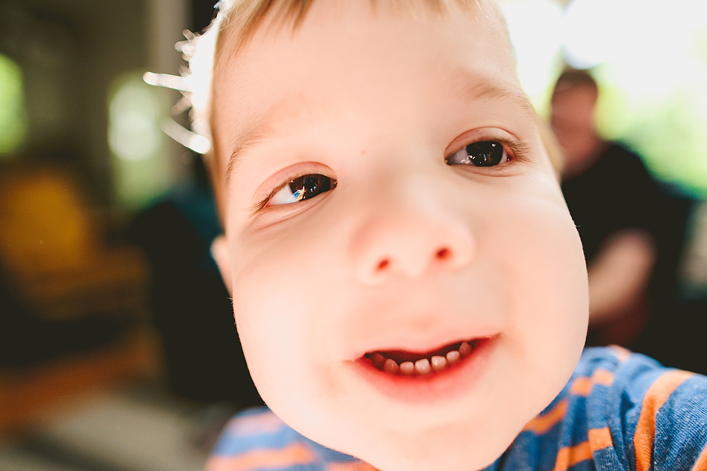 Toddler taking selfie with camera