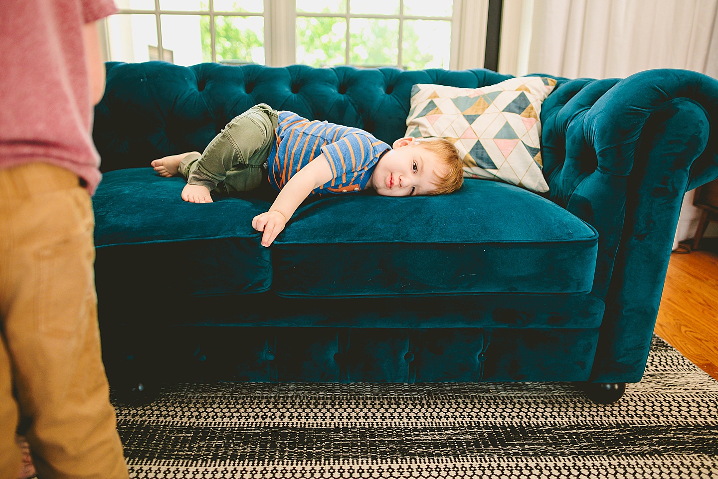 Toddler laying on couch