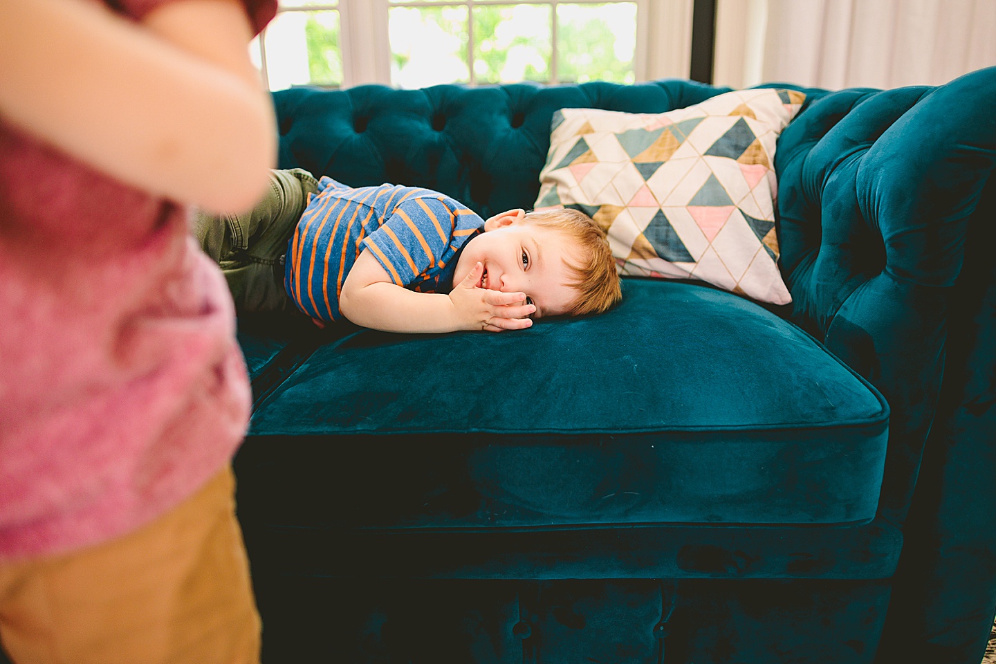 Toddler laying on couch