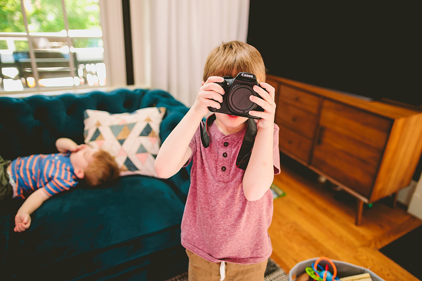 Kid taking a picture of a photographer