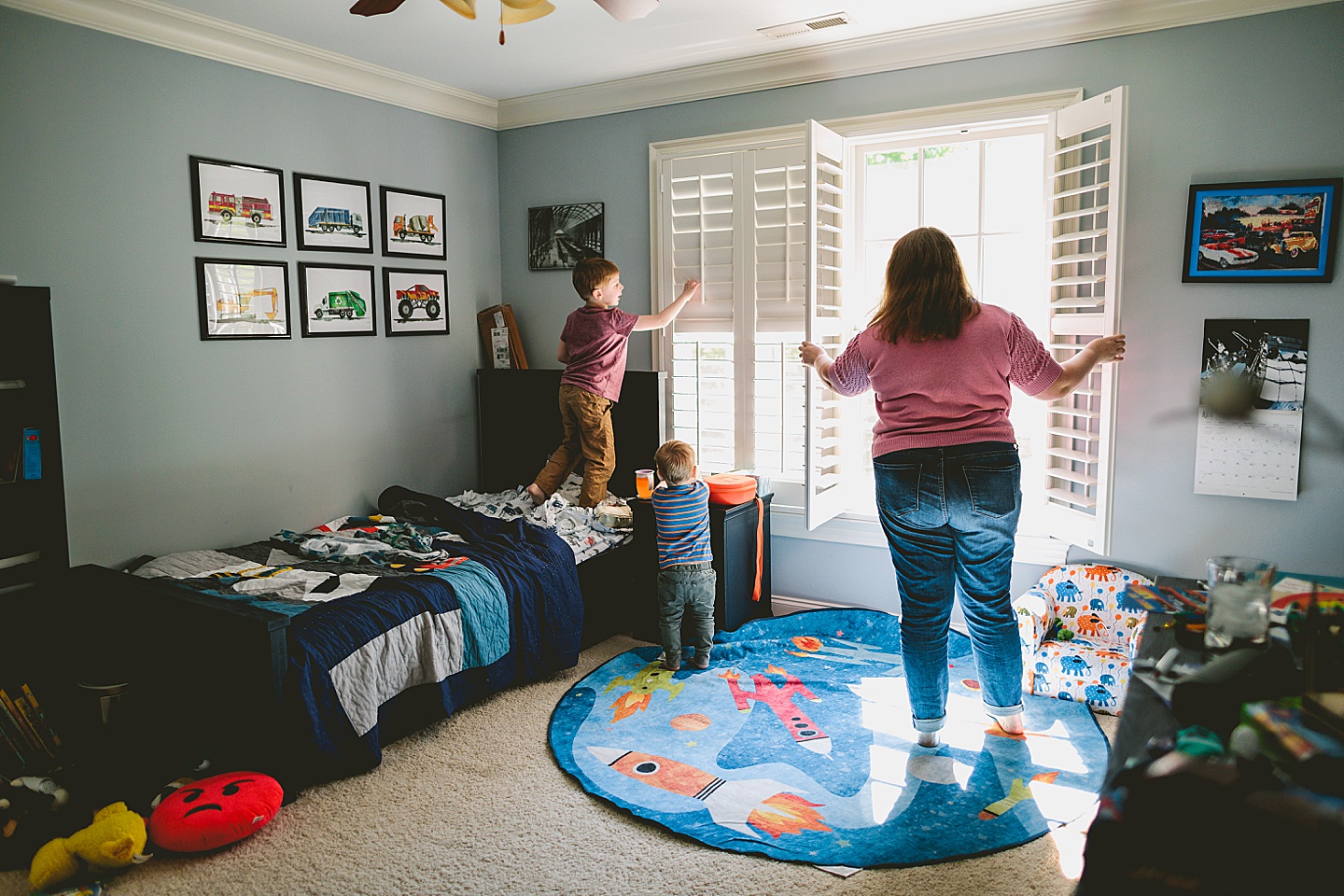 Kids helping mom open shutters