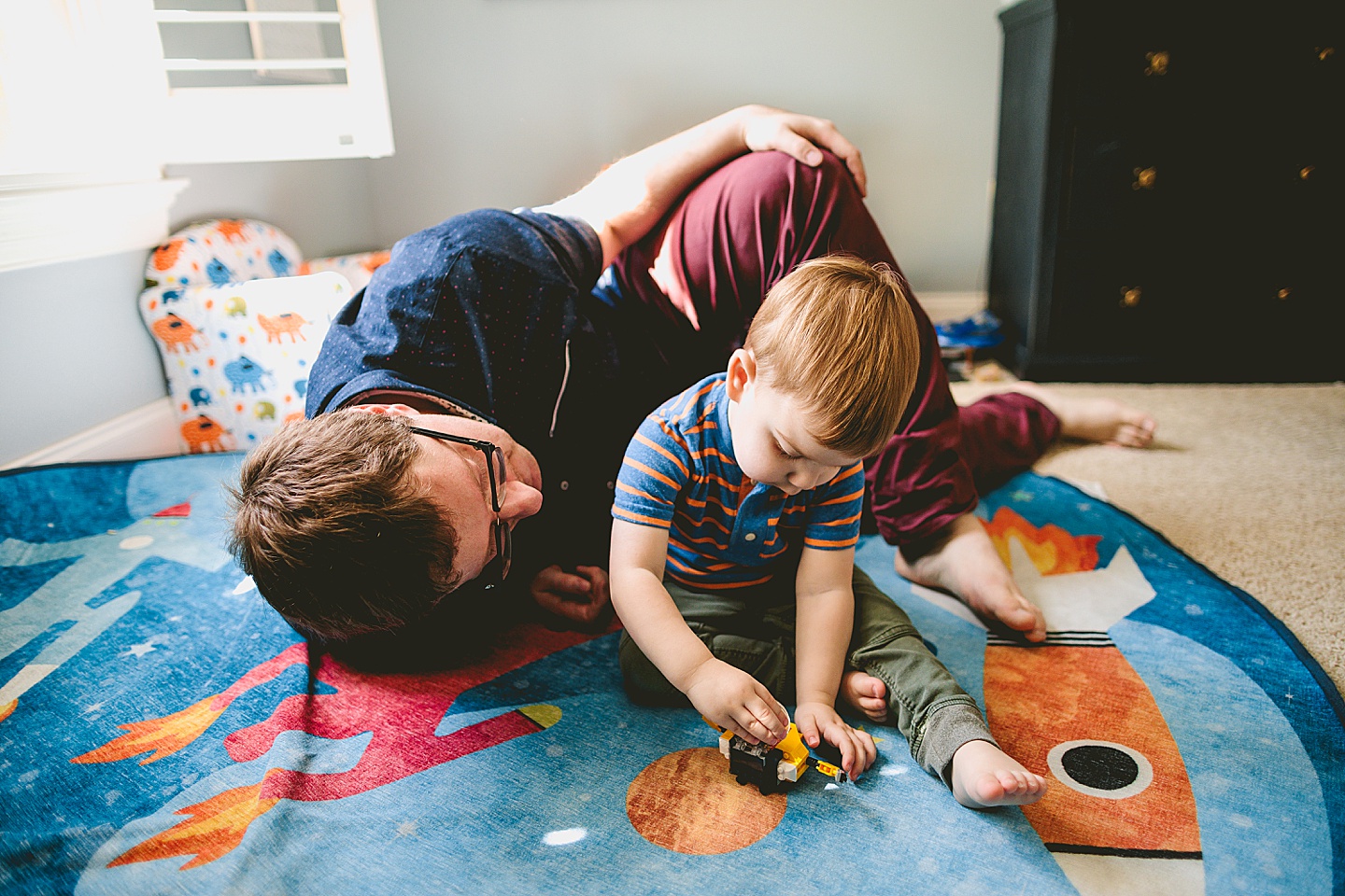 Dad playing with son