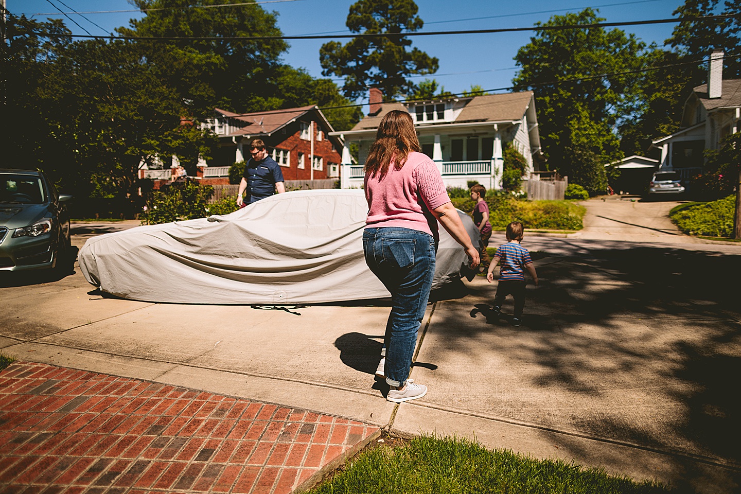 Family walking out to uncover DeLorean