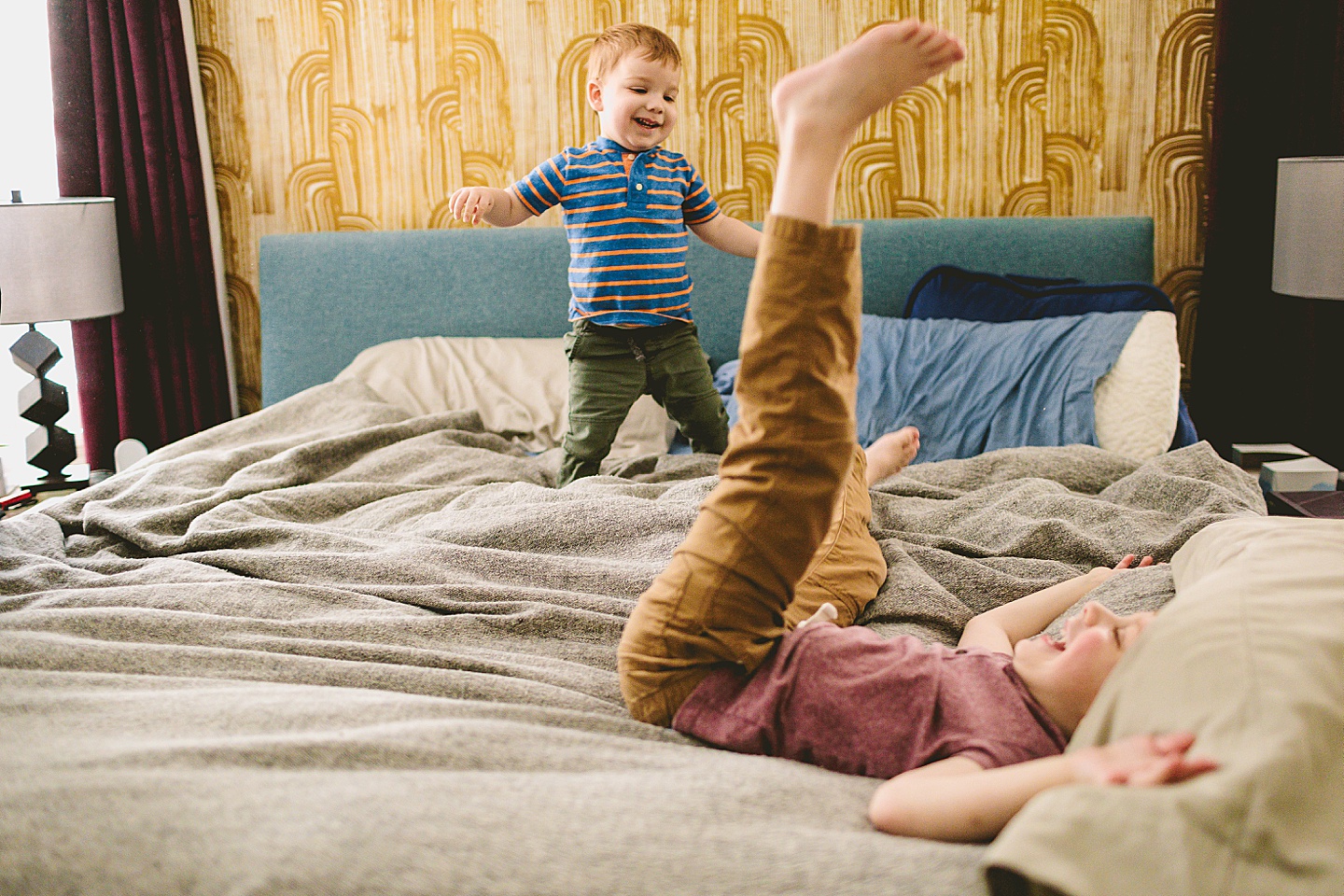 Kids playing on bed