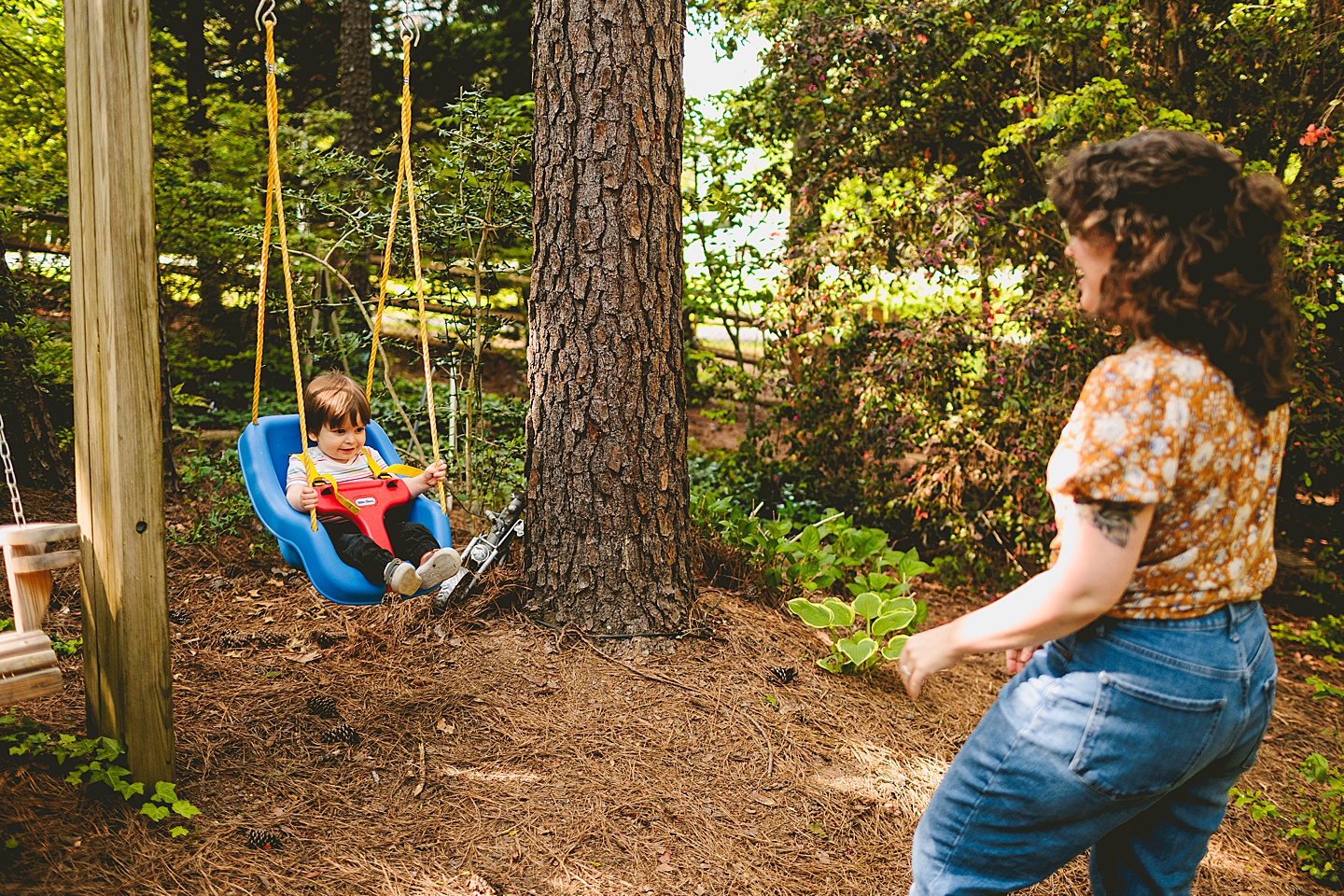 Toddler swinging on swing